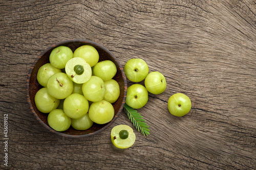 Fototapeta Naklejka Na Ścianę i Meble -  Flat lay of Fresh amla (Indian gooseberry) fruits on old wood background.