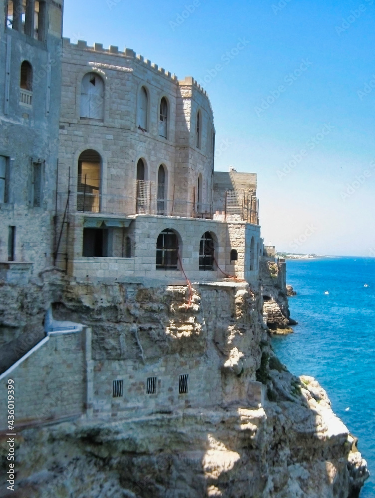 Stone houses on the shores of the adriatic sea. Polignano a Mare. Apulia (Puglia). Italy. Europe Stone houses on the shores of the adriatic sea. Polignano a Mare. Apulia (Puglia). Italy. Europe