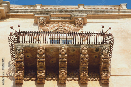 Palazzo Nicolaci is one of the main examples of Sicilian Baroque. The balconies with curved iron railings, corbels in carved stone with grotesque figures. photo