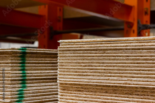 Картината върху платно Photo of plywood panels stacked in construction supply store shelves