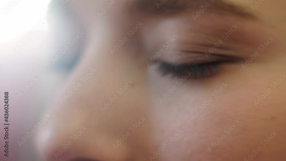close up. A beautiful girl with long hair do eye makeup. close up. A beautiful girl with long hair do eye makeup.