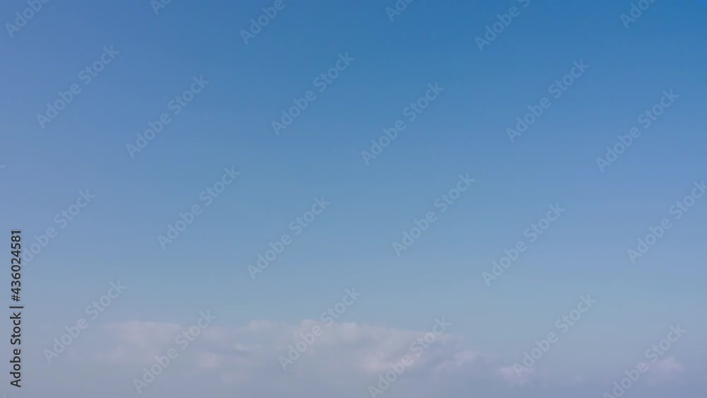white soft clouds flying low level of pastel blue sky in the atmosphere. white soft clouds flying low level of pastel blue sky in the atmosphere.