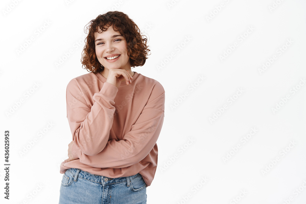 Beautiful happy woman with short hair, laughing and smiling with white perfect teeth, showing healthy smile, standing against white background Beautiful happy woman with short hair, laughing and smiling with white perfect teeth, showing healthy smile, standing against white background