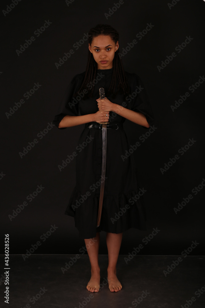 Beautiful woman holding a katana sword Beautiful woman holding a katana sword