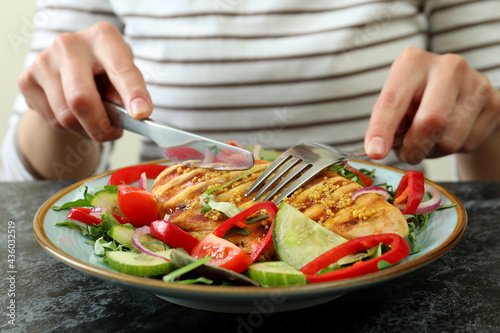Concept of tasty eating with salad with grilled chicken