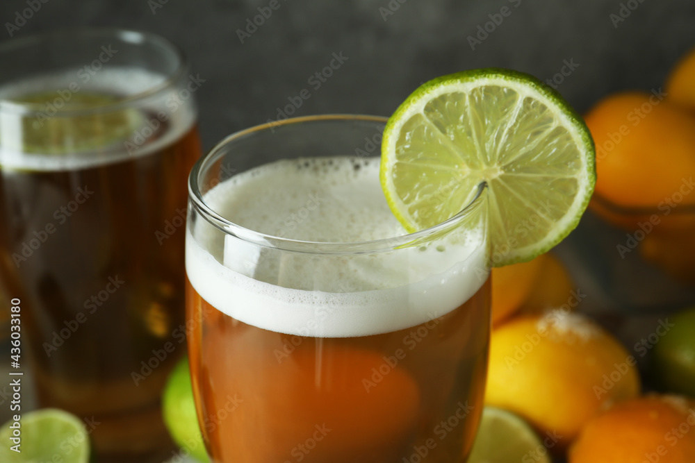 Glass of beer with lime slice, close up Glass of beer with lime slice, close up