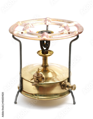 Old brass stove (primus), isolated on white background.