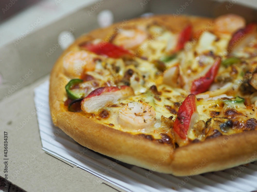 Pizza Seafood Cocktail pan on top with Shrimp, Crab Sticks, Ham, Pineapple and Sauce in paper box, fast food Pizza Seafood Cocktail pan on top with Shrimp, Crab Sticks, Ham, Pineapple and Sauce in paper box, fast food