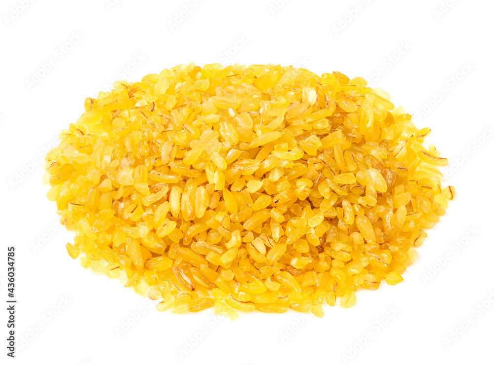 handful of raw bulgur groats closeup on white handful of raw bulgur groats closeup on white