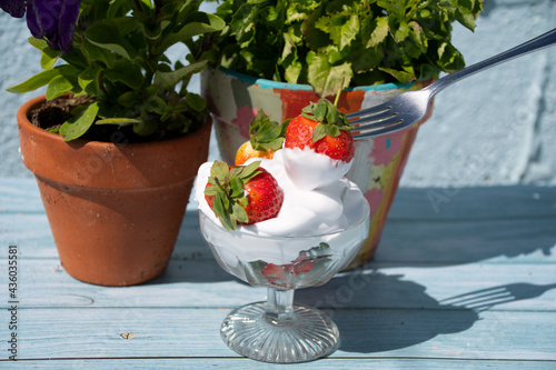 Strawberries and  cream  traditional  brattish summer food  photo