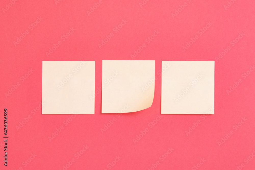 Yellow postit on pink background Yellow postit on pink background