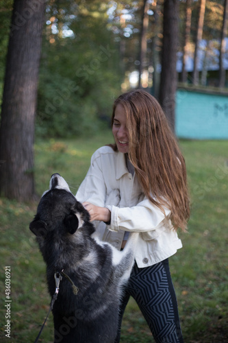 the girl is very happy with the dog