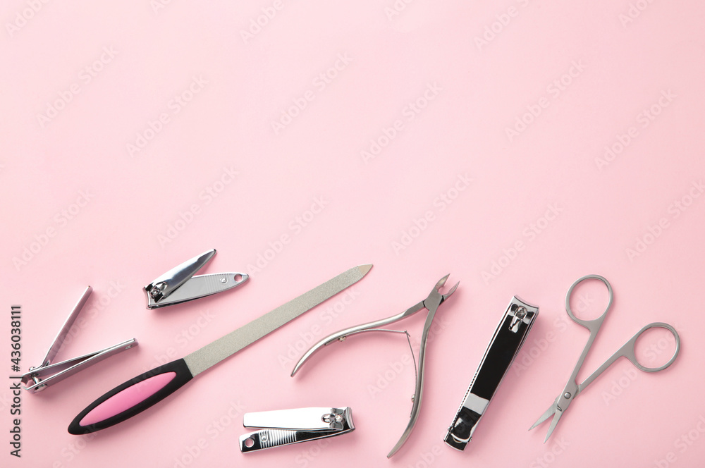 Tools of a manicure set on pink background with copy space. Tools of a manicure set on pink background with copy space.