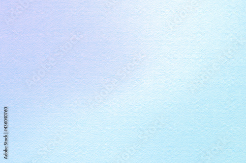 Background of natural canvas texture dyed in purple sky-blue gradation