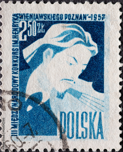 POLAND-CIRCA 1957 : A post stamp printed in Poland showing Third International Henryk Wieniawski Violin Players Competition in Poznan photo