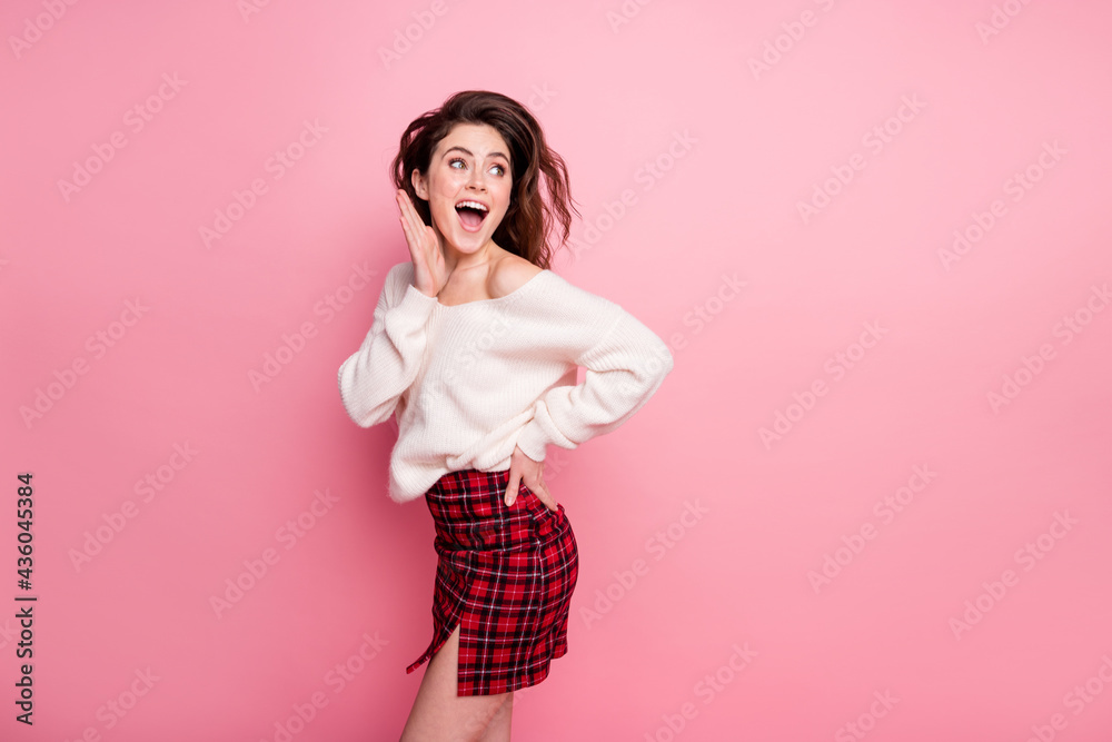 Profile side photo of young girl happy positive amazed surprised sale news look empty space isolated over pink color background Profile side photo of young girl happy positive amazed surprised sale news look empty space isolated over pink color background