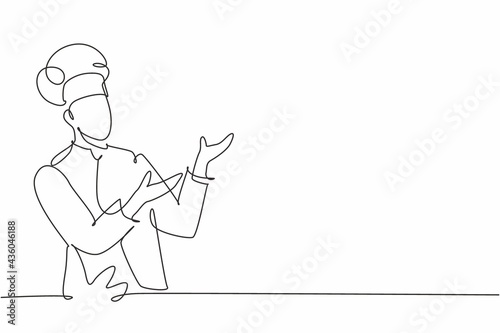 Single continuous line drawing of young friendly man chef in uniform pose serving menu at screen display. Online food restaurant banner concept one line drawing design vector graphic illustration