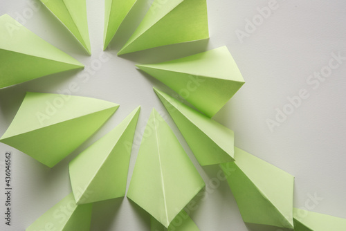 folded green paper squares