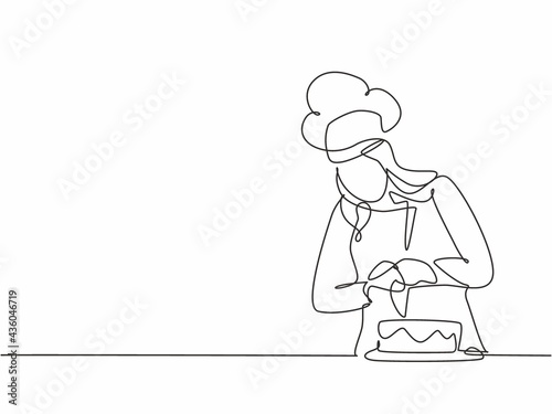 Single continuous line drawing young female chef decorating birthday pastry cake with whipping cream on restaurant kitchen. Bakery food concept one line drawing design vector minimalism illustration