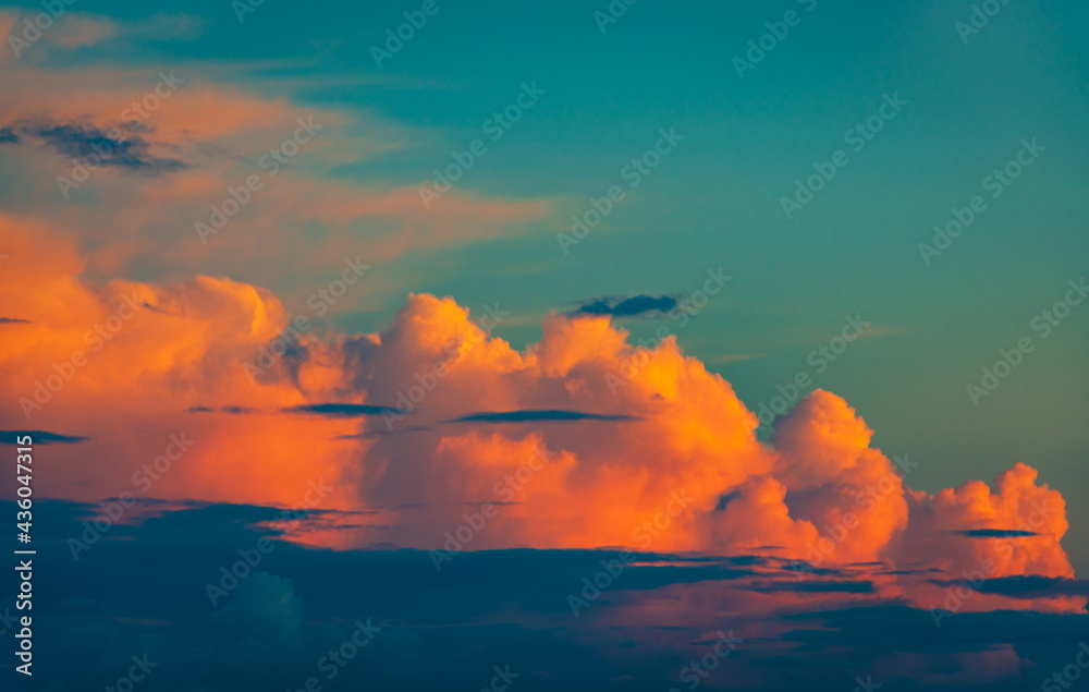Фотография Teal sky and orange clouds, abstract background