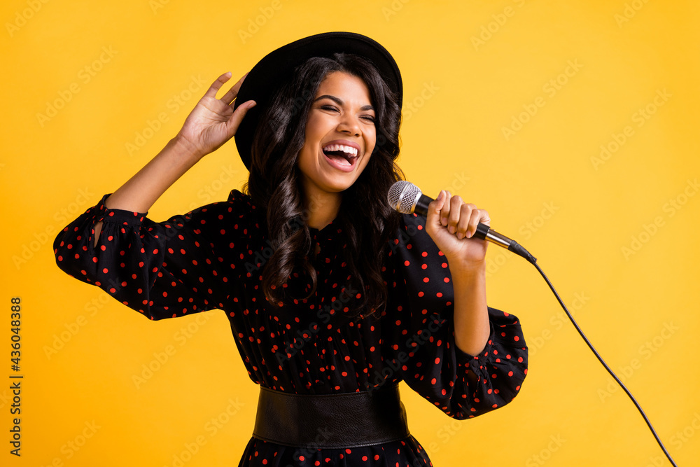 Φωτογραφία Portrait of positive excited dark skin girl closed eyes hand touch headwear isol