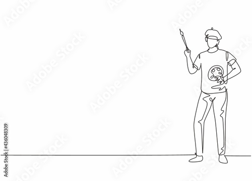 Single one line drawing of young painter man pose standing and holding paintbrush. Professional work profession and occupation minimal concept. Continuous line draw design graphic vector illustration
