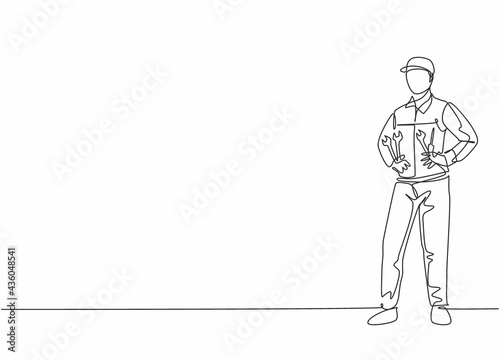 Single one line drawing of young male mechanic pose standing on workshop garage. Professional work profession and occupation minimal concept. Continuous line draw design graphic vector illustration