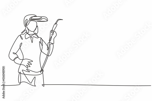 Single continuous line drawing of young attractive female welder holding hands on hip. Professional work job occupation. Minimalism concept one line draw graphic design vector illustration