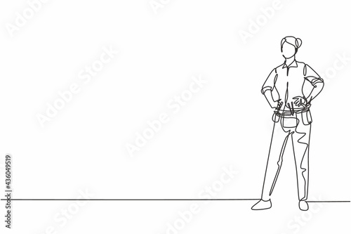 Continuous one line drawing of young beauty female mechanic standing with hands on hip. Professional job profession minimalist concept. Single line draw design vector graphic illustration
