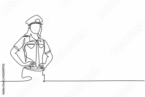 Continuous one line drawing of young beauty female police on uniform standing with hands on hip. Professional job profession minimalist concept. Single line draw design vector graphic illustration photo