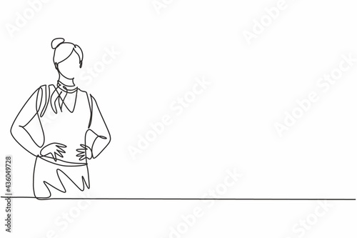 Single one line drawing of young beauty female stewardess posing with hands on hip. Professional work profession and occupation minimal concept. Continuous line draw design graphic vector illustration