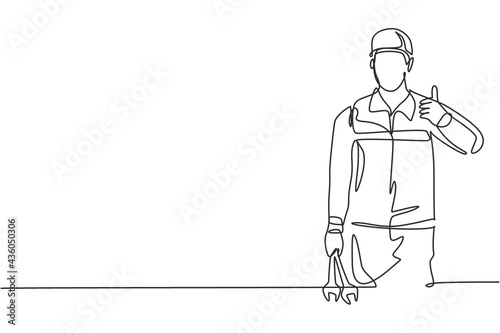 Single continuous line drawing mechanic with the gesture of lifting his thumb and holding the wrench works to fix a broken car engine in the garage. One line draw graphic design vector illustration.