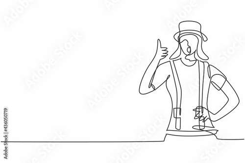 Single one line drawing of female mime artist with thumbs-up gesture and white face make-up puts on a silent motion comedy show at circus arena. Continuous line draw design graphic vector illustration