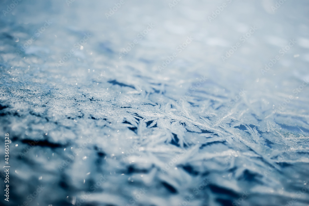 Blue ice background. Blurred. Dark blue and white. Ice surface pattern. Blue ice background. Blurred. Dark blue and white. Ice surface pattern.