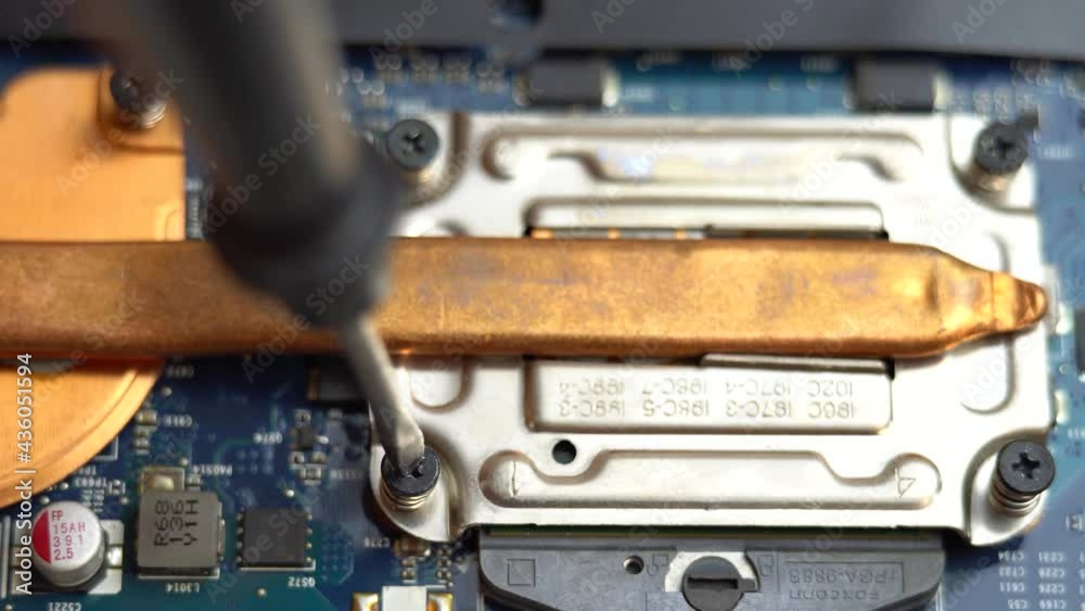 Installing a copper cooling system on a laptop processor, copper heatsink on a laptop chip Installing a copper cooling system on a laptop processor, copper heatsink on a laptop chip