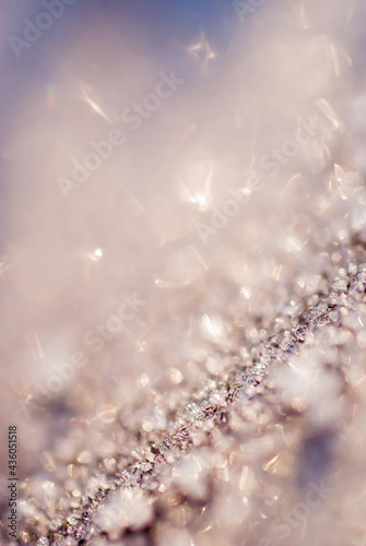 Glittering background. Sparkling ice. Macro photo ice. Purple and gold. Place for copy. Place for text. Festive. New years eve, christmas.
