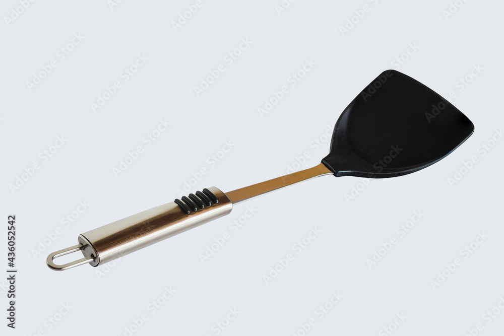 A flipper used in frying a food at asian cooking. A flipper used in frying a food at asian cooking.
