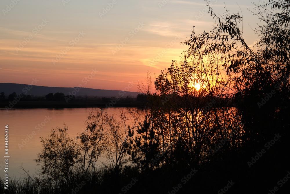 Landscape, sunset, beautiful sky. Lake shore with trees. Landscape, sunset, beautiful sky. Lake shore with trees.