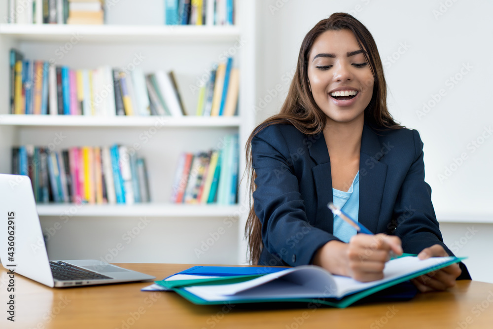 Working at office - Young businesswoman at desk Working at office - Young businesswoman at desk