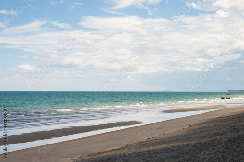 Tranquil beach with cloudy sky in tropical sea at Gulf of Thailand on summertime