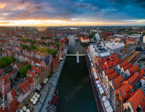 Amazing architecture of the main city in Gdansk at sunset, Poland. Aerial view of Granaries Island at the Motlawa rover
