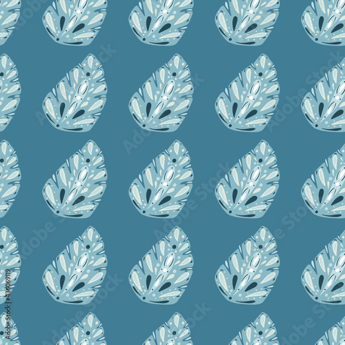 Exotic foliage seamless pattern with doodle folk monstera leaves ornament. Blue background.