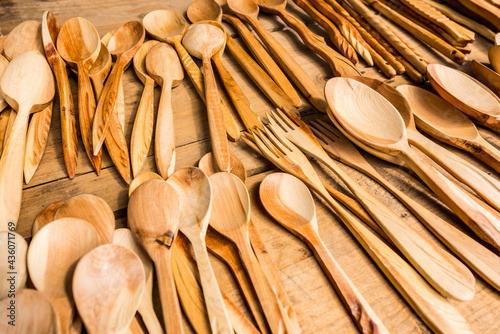 Wooden spoons and forks on the shelf