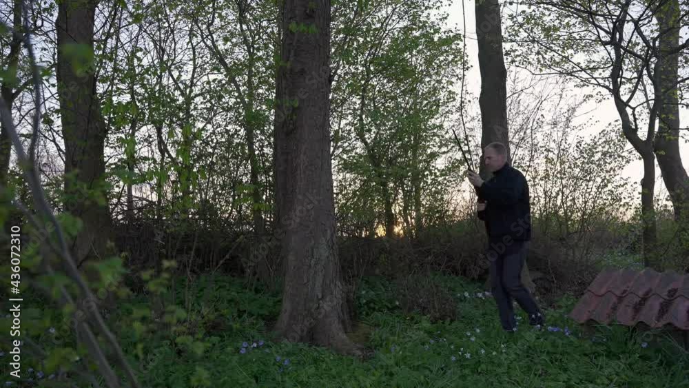 Male hunter walking through the forrest on the hunt Male hunter walking through the forrest on the hunt