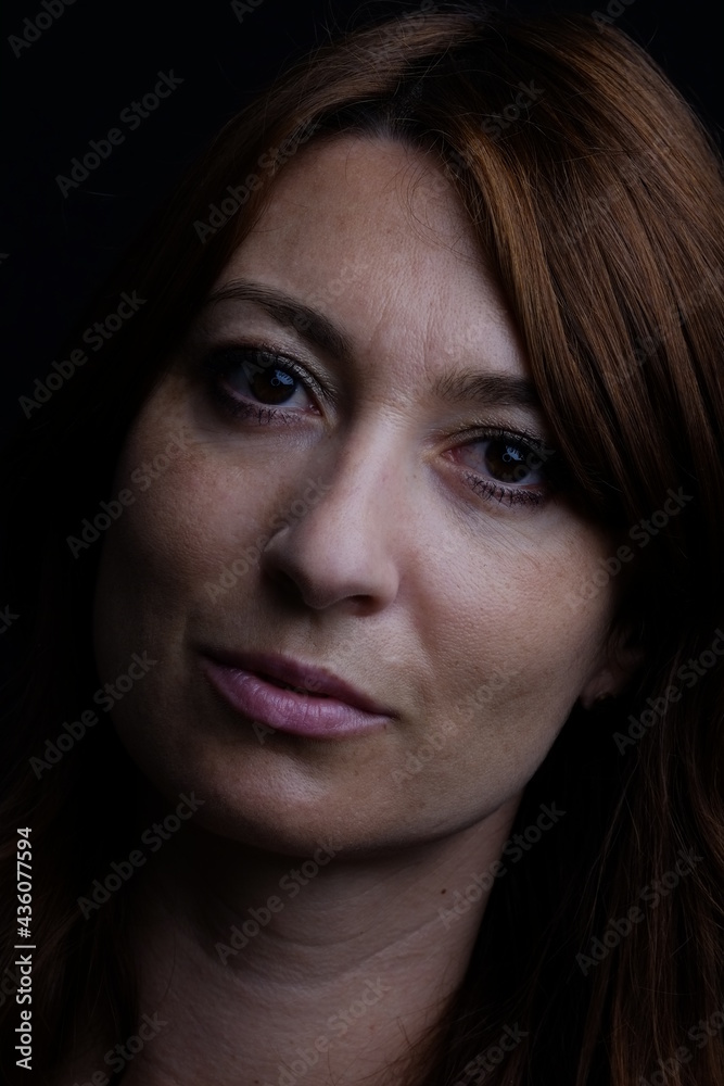 Caucasian woman portrait with black background Caucasian woman portrait with black background