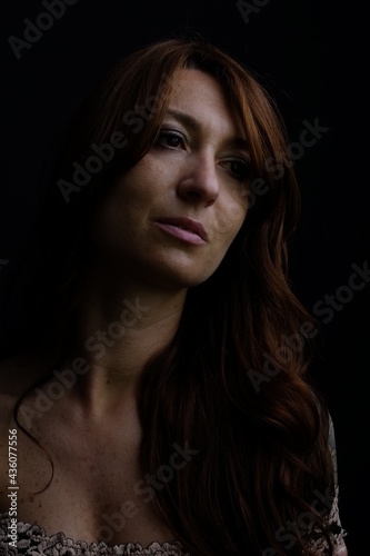Caucasian woman portrait with black background