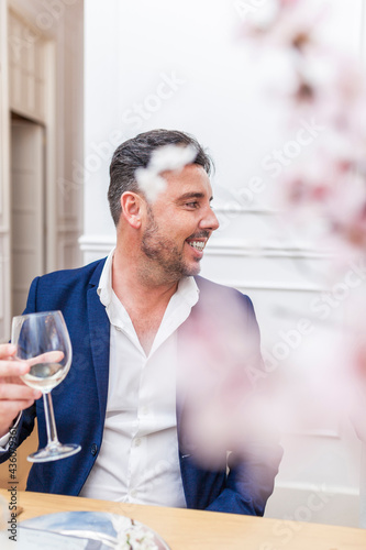 Smiling man at a dinner party
