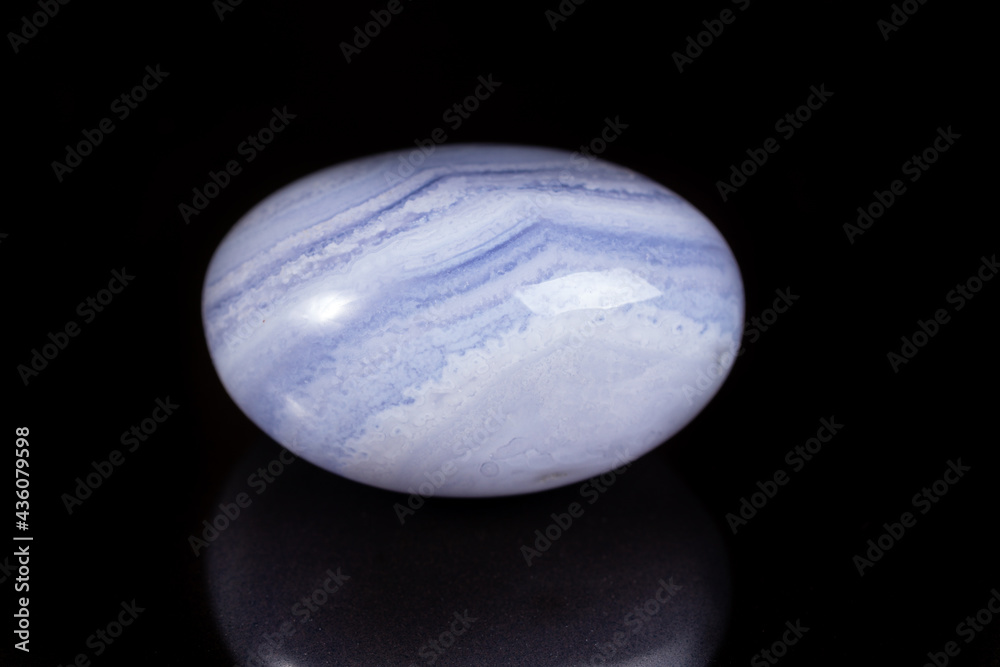 Macro mineral stone blue agate on black background Macro mineral stone blue agate on black background