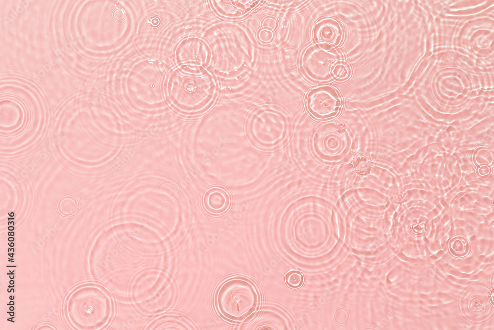 Pink transparent clear calm water surface texture with ripples, splashes and bubbles Abstract summer nature background Coral colored waves in sunlight Cosmetic moisturizer micellar toner emulsion Pink transparent clear calm water surface texture with ripples, splashes and bubbles Abstract summer nature background Coral colored waves in sunlight Cosmetic moisturizer micellar toner emulsion