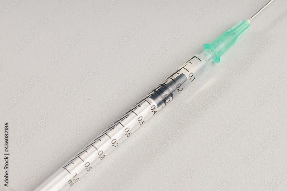 close-up of a syringe pulled up with a vaccination serum close-up of a syringe pulled up with a vaccination serum